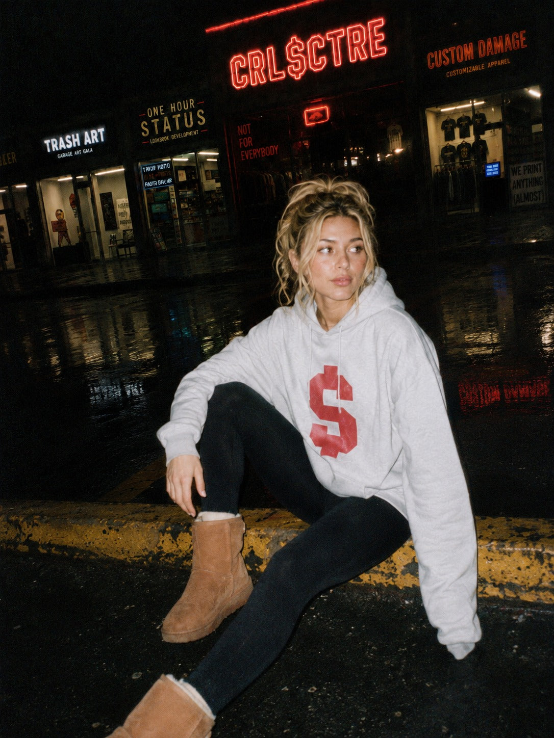 CRL$CTRE model posing in gray hoodie