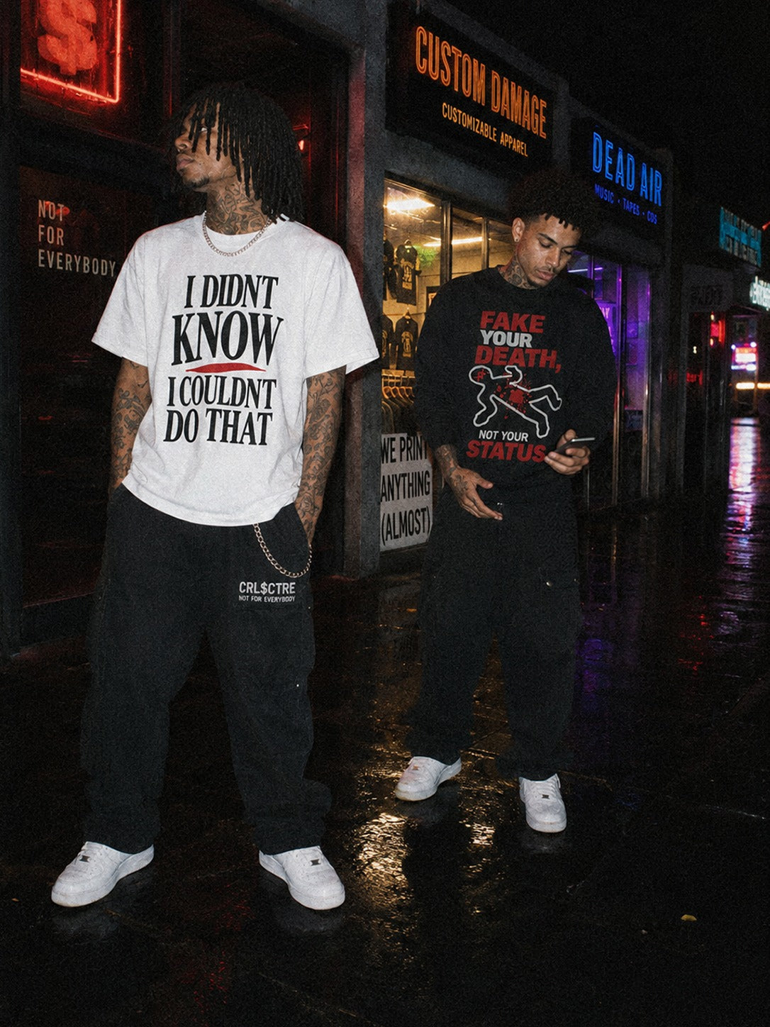 Two CRL$CTRE models wearing graphic shirts