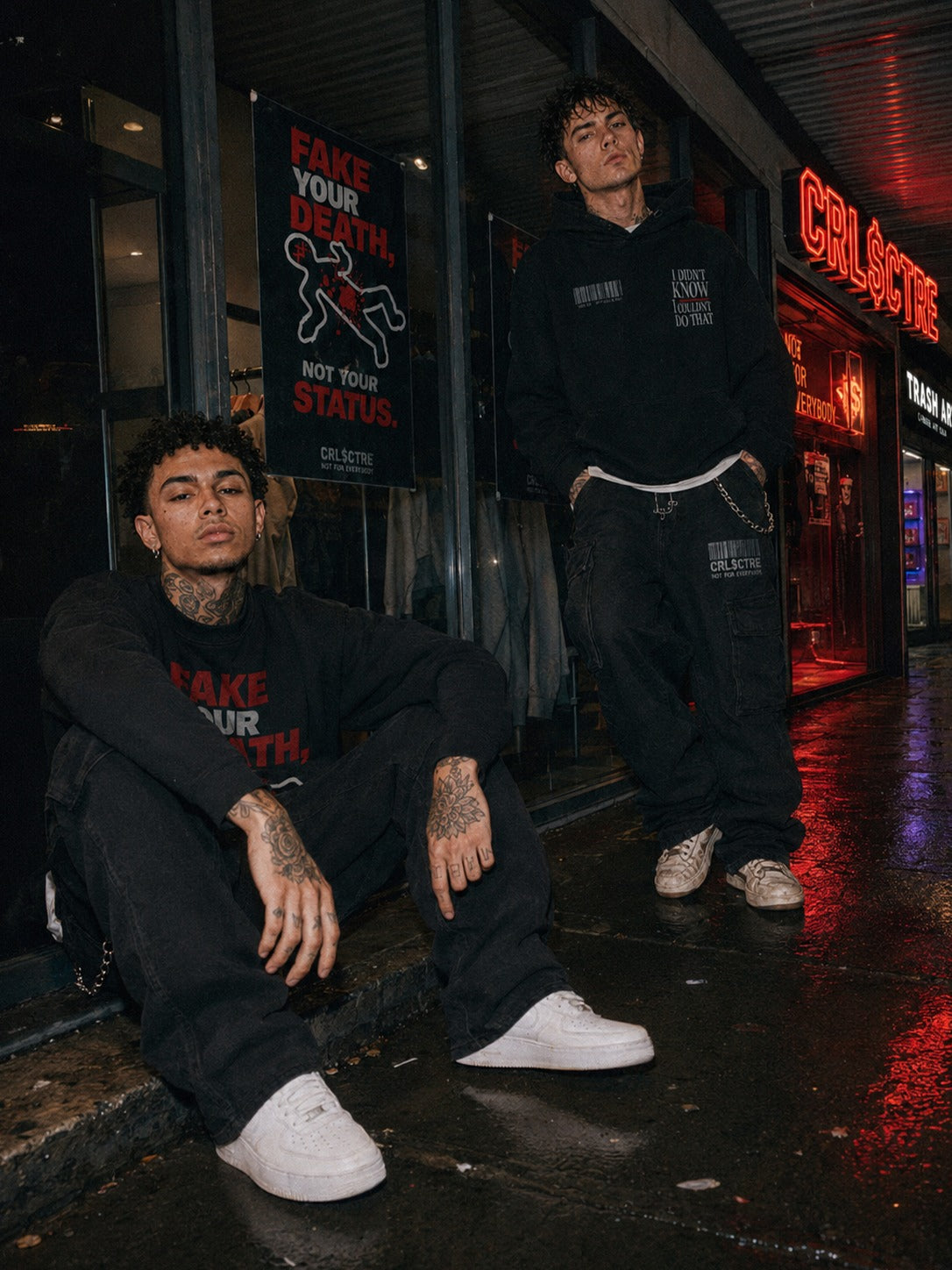 Two male CRL$CTRE models in black clothing